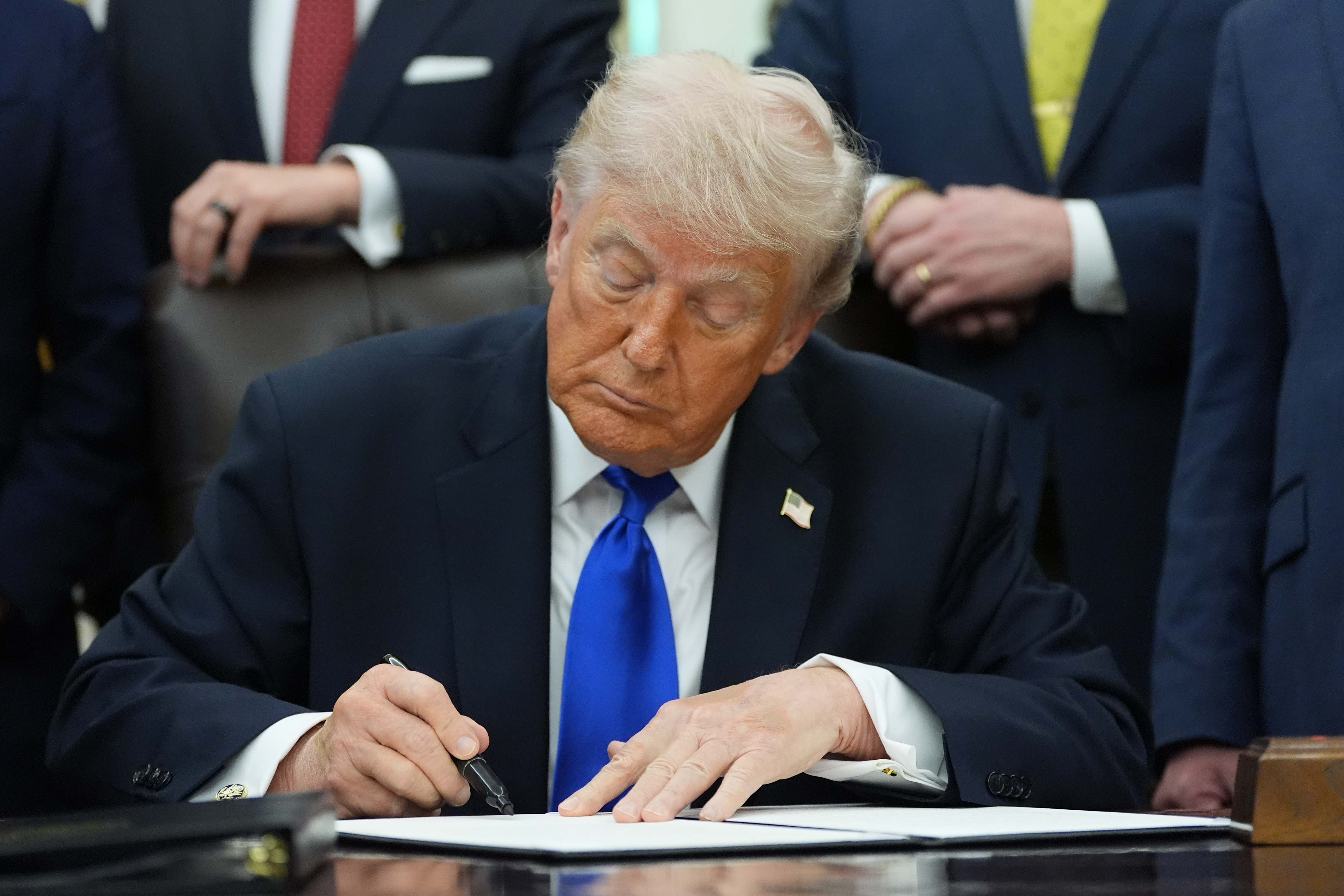 President Donald Trump signs a presidential permit regarding pipeline construction in the Oval Office of the White House, Thursday, April 30, 2026, in Washington.