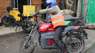 A rider sits on an electric Spiro motorcycle in Nairobi, Kenya, Tuesday, Feb. 24, 2026.