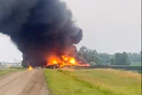 Smoke fills the sky after a train derailment near Carrington, N.D., July 5, 2024