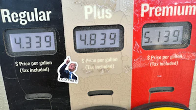 A sticker with the image of President Trump points to per-gallon prices for gasoline at a Conoco station in Denver, May 30, 2026.