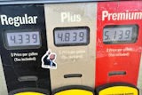 A sticker with the image of President Trump points to per-gallon prices for gasoline at a Conoco station in Denver, May 30, 2026.