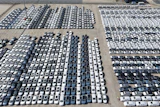 An aerial view of new cars awaiting export to oversea markets is seen at a port in Shanghai, March 10, 2026.