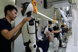 Workers assemble robot at the LY iTech Beijing Super Factory for Embodied Artificial Intelligence during a media tour in the Beijing E-Town on the outskirts of Beijing on May 29, 2026.