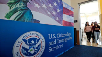 In this Aug. 17, 2018, file photo, people arrive before the start of a naturalization ceremony at the U.S. Citizenship and Immigration Services Miami Field Office in Miami.