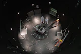This photo provided by NASA shows Kieran Wilson, LINK’s principal investigator, and Hunter Robertson, a space systems engineer, both at Katalyst Space, standing next to their spacecraft inside the SES (Space Environment Simulator) at NASA’s Goddard Space Flight Center in Greenbelt, Md., April 17, 2026, ahead of thermal vacuum testing.