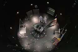 This photo provided by NASA shows Kieran Wilson, LINK’s principal investigator, and Hunter Robertson, a space systems engineer, both at Katalyst Space, standing next to their spacecraft inside the SES (Space Environment Simulator) at NASA’s Goddard Space Flight Center in Greenbelt, Md., April 17, 2026, ahead of thermal vacuum testing.