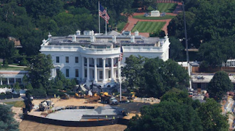 Construction workers continue designing a helipad for Marine One at the White House South Lawn, Wednesday, July 1, 2026, in Washington.