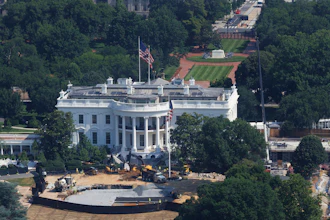 Construction workers continue designing a helipad for Marine One at the White House South Lawn, Wednesday, July 1, 2026, in Washington.