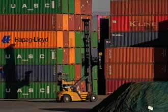 Shipping containers stacked at a depot in Johannesburg, South Africa, Aug. 1, 2025.
