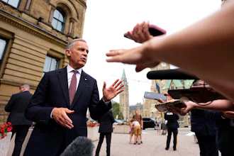 Canada Prime Minister Mark Carney takes questions outside the Office of the Prime Minister and Privy Council in Ottawa, July 21, 2026.