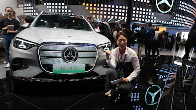 A vlogger promotes the GLC SUV at the Mercedes-Benz booth during Auto China 2026 in Beijing, on April 24, 2026. Major German carmakers saw sharp quarterly sales declines in China, as domestic demand weakened and competition heats up in the world’s biggest auto market.