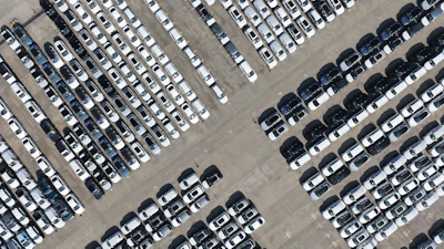 An aerial view of new cars awaiting export to oversea markets is seen at a port in Shanghai, March 10, 2026.