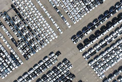 An aerial view of new cars awaiting export to oversea markets is seen at a port in Shanghai, March 10, 2026.