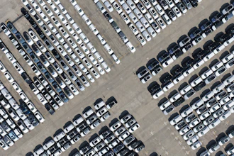 An aerial view of new cars awaiting export to oversea markets is seen at a port in Shanghai, March 10, 2026.