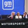 President Donald Trump, center left, speaks with Mary Barra, chair and CEO of General Motors, center right, and General Motors President Mark Reuss, right, as Transportation Secretary Sean Duffy listens at left, during a driving demonstration at General Motors proving ground, Monday, July 27, 2026, in Milford, Mich.