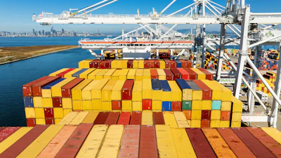 Cargo containers line a ship at the Port of Oakland on Wednesday, Aug. 6, 2025, in Oakland, Calif.