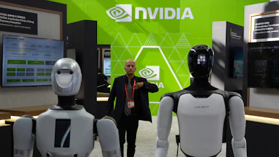 A worker stands near robots at the Nvidia booth during the China International Supply Chain Expo in Beijing on June 22, 2026.