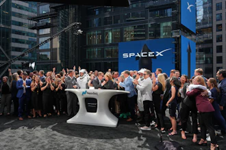 SpaceX employees celebrate during a closing bell ceremony for the IPO of SpaceX at the Nasdaq MarketSite in New York, Friday, June 12, 2026, in New York.