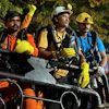 In this image provided by the Information and Public Relations Department, Government of Sikkim, rescue workers stand outside an under-construction tunnel at a hydropower project in Samardung village, about 40 kilometers (25 miles) from Gangtok, India, Wednesday, July 22, 2026.