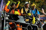 In this image provided by the Information and Public Relations Department, Government of Sikkim, rescue workers stand outside an under-construction tunnel at a hydropower project in Samardung village, about 40 kilometers (25 miles) from Gangtok, India, Wednesday, July 22, 2026.