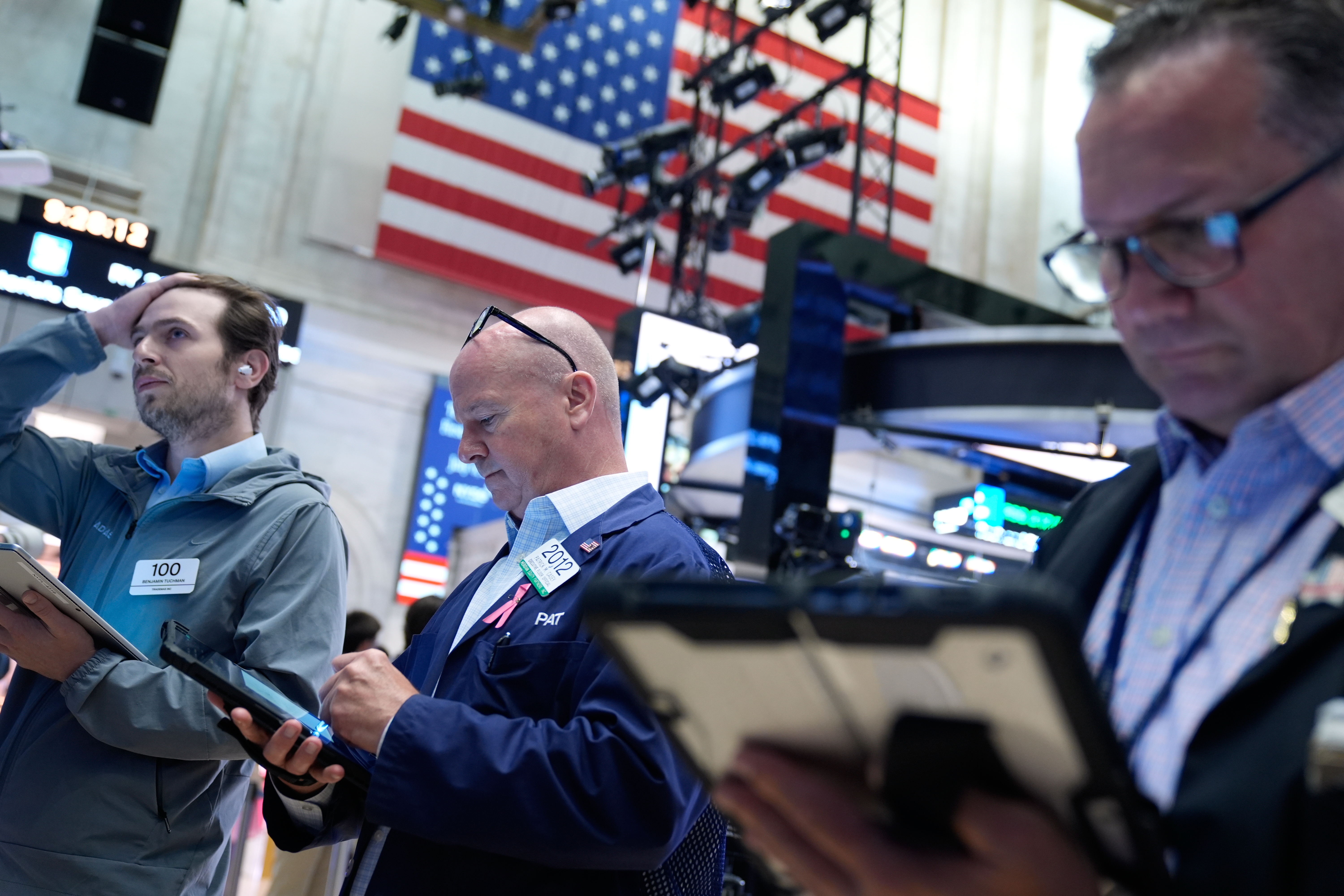 Traders work on the floor at the New York Stock Exchange in New York, Monday, July 6, 2026.