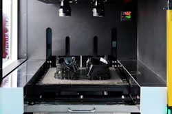 A vat photopolymerization process fabricates a component by curing liquid resin layer by layer using light.