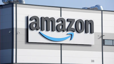An Amazon company logo marks the facade of a building, March 18, 2022, in Schoenefeld near Berlin.