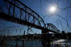 The Union Pacific International Railroad Bridge is seen behind concertina wire, Eagle Pass, Texas, Sept. 22, 2023.