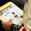 A job seeker waits to talk to a recruiter at a job fair in Sunrise, Fla., Aug. 28, 2025.