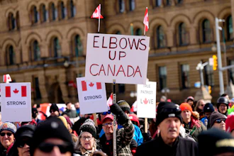 Signs at a rally on Parliament Hill in Ottawa, March 9, 2025.