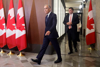 Prime Minister Mark Carney and Canada-U.S. Trade Minister Dominic LeBlanc arrive at a news conference on Parliament Hill, Ottawa, Aug. 22, 2026.