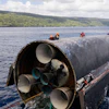 This image provided by SpaceX on Aug. 27, 2026, shows engineers inspecting Starship off the coast of Christmas Island in the Indian Ocean, following its launch on a test flight back in July.