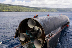 This image provided by SpaceX on Aug. 27, 2026, shows engineers inspecting Starship off the coast of Christmas Island in the Indian Ocean, following its launch on a test flight back in July.