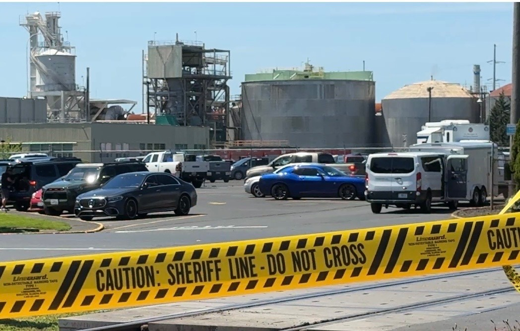 Yellow police tape is seen on May 27, 2026 outside the Longview, Wash. paper mill where a deadly chemical tank failure occurred.
