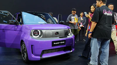 Visitors examine a Honda Super-One EV during the Indonesia International Auto Show organized by the Association of Indonesian Automotive Industries (GAIKINDO) in Tangerang, Indonesia, Thursday, July 30, 2026.