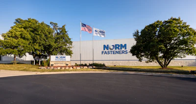 NORM Fasteners industrial facility exterior with company signage and American flag