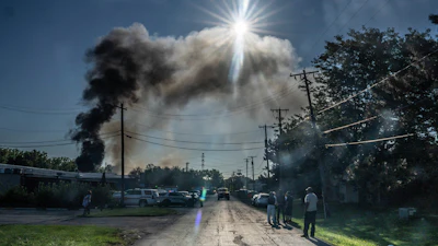 Firefighters work to put out a blaze after an explosion at Brent Industries, Tuesday, Aug. 18, 2026, in Toledo, Ohio.