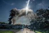 Firefighters work to put out a blaze after an explosion at Brent Industries, Tuesday, Aug. 18, 2026, in Toledo, Ohio.