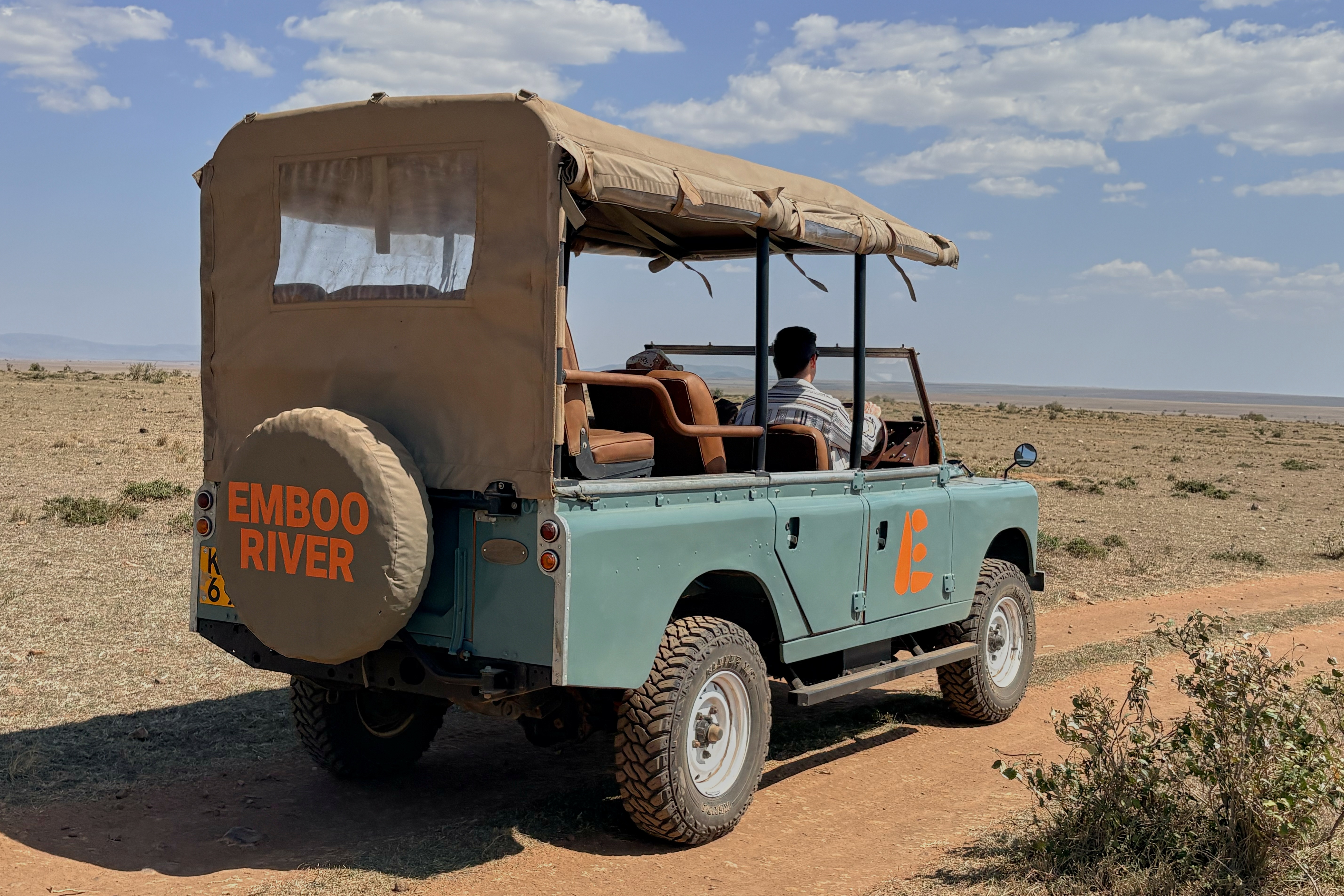 In this photo taken with a smartphone, an electric safari van operated by Emboo Camp drives through the Maasai Mara, Kenya, Saturday, Aug. 29, 2026.