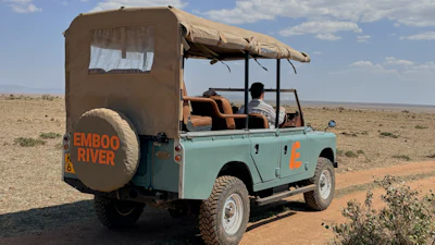 In this photo taken with a smartphone, an electric safari van operated by Emboo Camp drives through the Maasai Mara, Kenya, Saturday, Aug. 29, 2026.