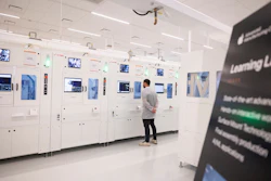 An Apple employee watches a machine in a learning lab at Apple's Advanced Manufacturing Center, Houston, Aug. 13, 2026.