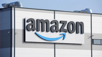 An Amazon company logo marks the facade of a building, March 18, 2022, in Schoenefeld near Berlin.