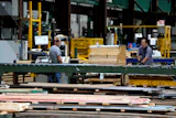 Workers in the manufacturing plant of Ideal Roofing, Ottawa, Aug. 25, 2026.