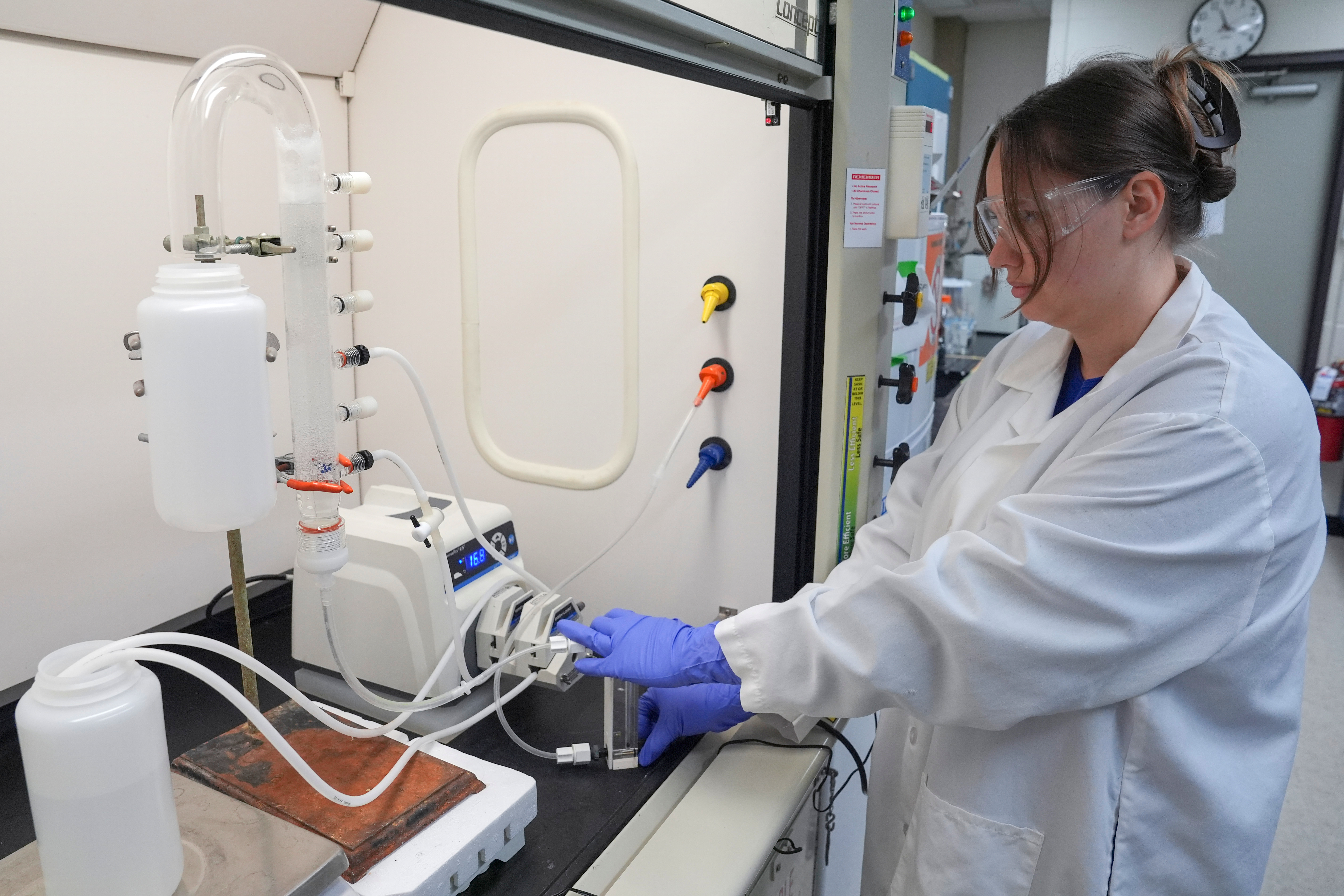 Stephanie Stoll starts a pump as part of an experiment studying the removal of PFAS from water samples at a U.S. Environmental Protection Agency lab in Cincinnati, April 10, 2024.