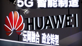 Signs promoting 5G wireless technology from Chinese technology firm Huawei are displayed at the PT Expo in Beijing on Sept. 26, 2018.
