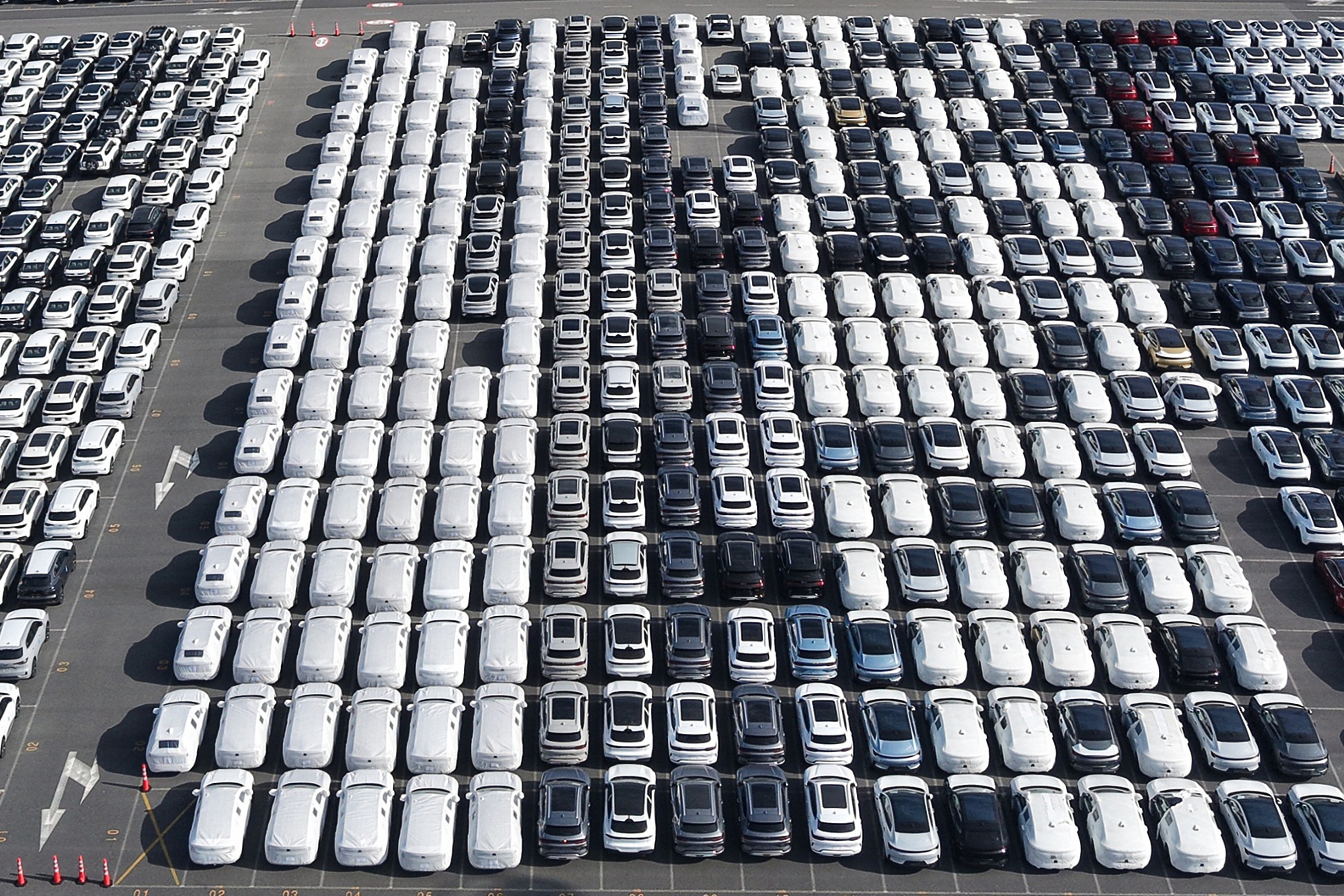 Aerial view of new cars waiting for shipment at a port in Shanghai, China, on Jan. 14, 2026.