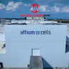 Aerial view of Ultium Cells manufacturing facility with branded signage and loading docks under blue sky