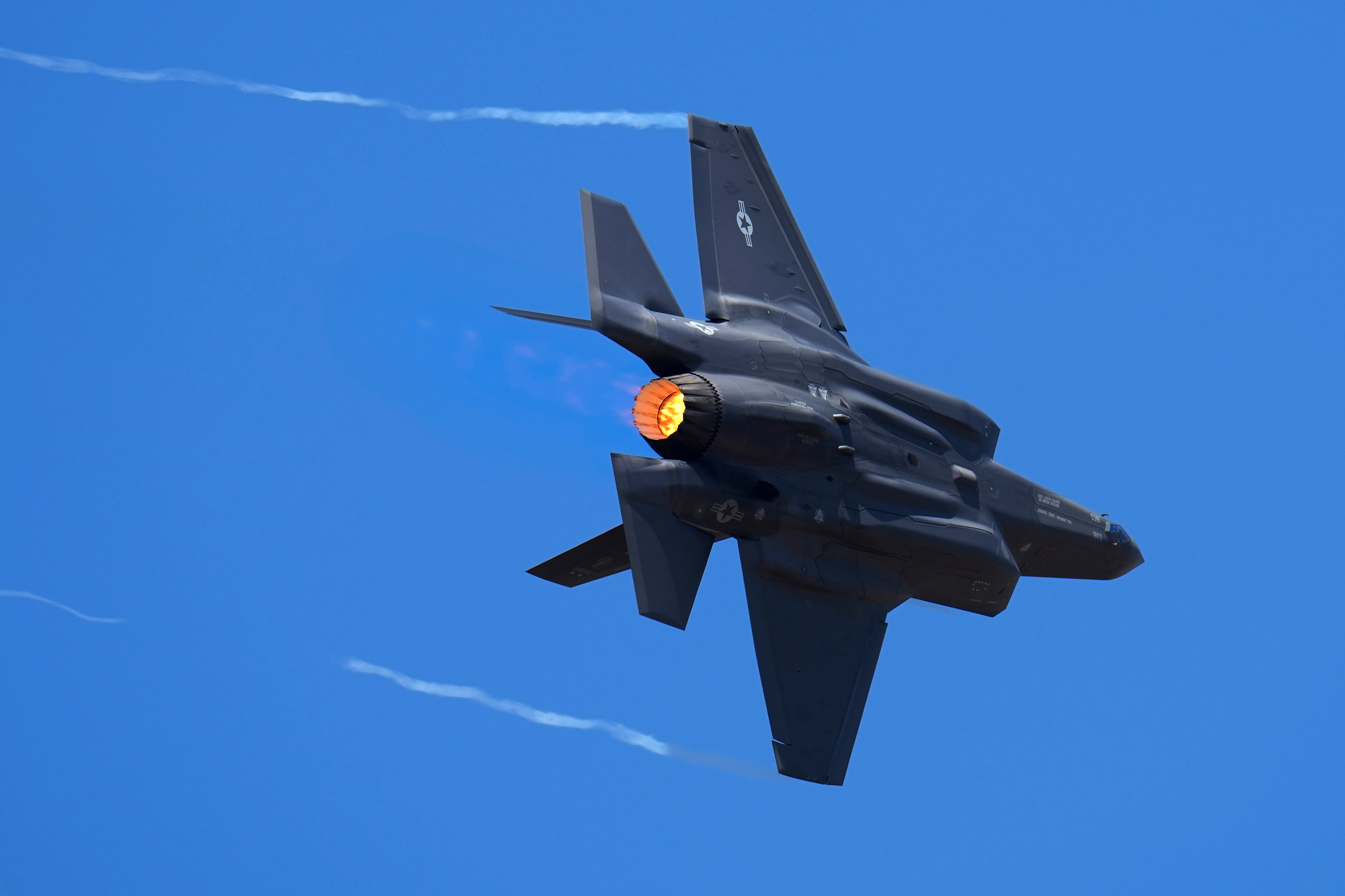 U.S. Air Force fighter aircraft F-35 performs aerobatic maneuvers on the second day of the Aero India 2023 at Yelahanka air base in Bengaluru, India, Feb. 14, 2023.