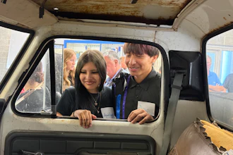 Students from Flandreau Indian School in South Dakota inspect a 1976 Ford F-350 utility truck.