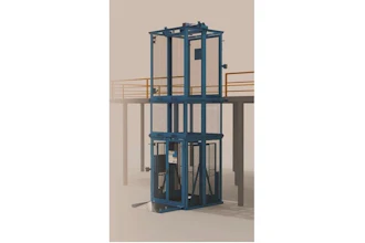 Blue industrial vertical lift platform with safety cage and railings on concrete structure